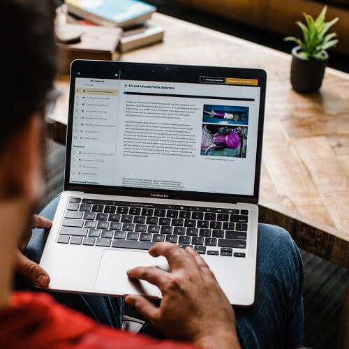 Student taking an online couse on a laptop